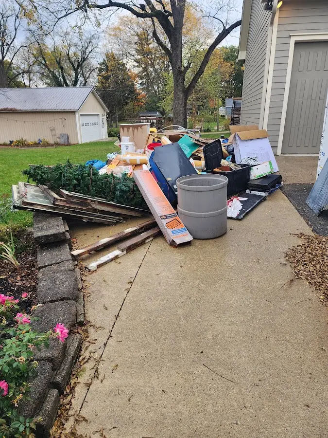 Dumpster being loaded with debris for 12 Yard Dumpster Rental in South Union